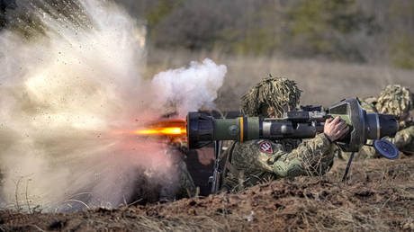 FILE PHOTO A Ukrainian serviceman fires a British-supplied NLAW anti-tank weapon.