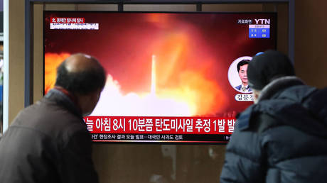 Onlookers at a Seoul train station are shown watching media coverage of a North Korean missile test earlier this year.