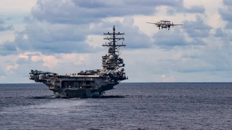 FILE PHOTO: A US warplane takes off from the USS Nimitz aircraft carrier during a deployment in the South China Sea, July 6, 2020.