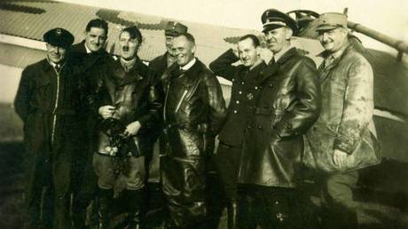 Photo taken from G. Baur during the arrest. “After the flight during the election campaign. September 2, 1932”. Hans Baur is in the center in a flight suit. © FSB Center for Public Relations