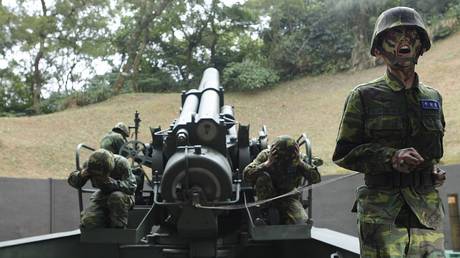 Taiwanese soldiers are shown operating a 240mm howitzer during a May 2013 military drill on Matsu Island.