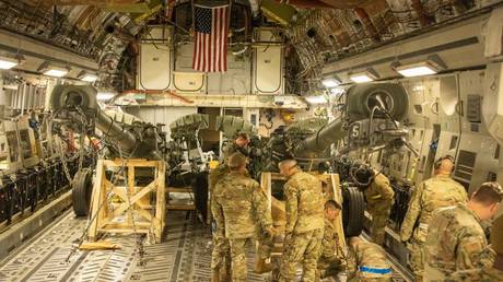 FILE PHOTO: U.S. Marines load an M777 155mm towed howitzer into the cargo bay of a U.S. Air Force C-17 Globemaster III at March Air Reserve Base, California April 21, 2022