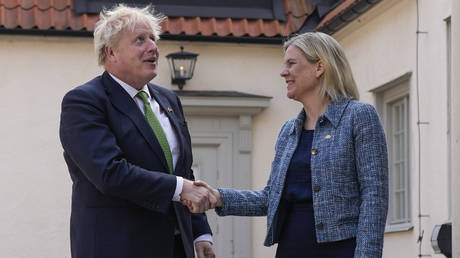 British Prime Minister Boris Johnson is welcomed by Sweden's Prime Minister Magdalena Andersson in Harpsund on May 11, 2022.