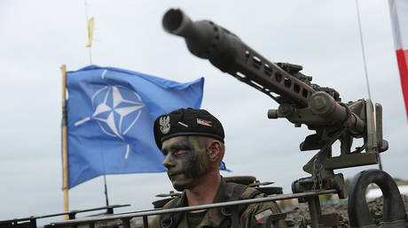 File photo: A NATO flag flies above a military exercise in Poland, June 18, 2015