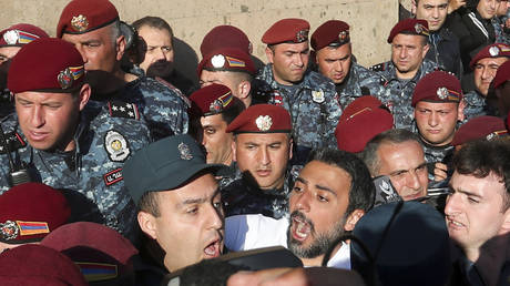 Police confront demonstrators in Yerevan, Armenia, May 5, 2022.