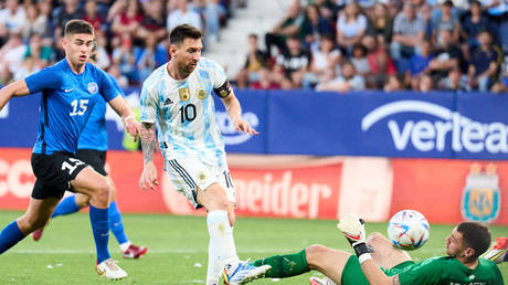 Lionel Messi scoring his team's fourth goal during the international friendly match between Argentina and Estonia. © Juan Manuel Serrano Arce/Getty Images