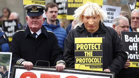A protester dressed as British Prime Minister Boris Johnson outside Hillsborough Castle in Northern Ireland, May 2022. © Liam McBurney / PA Images / Getty Images
