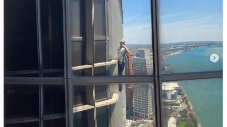 File photo: Maison DesChamps climbs a high-rise in Detroit, Michigan, May 2022