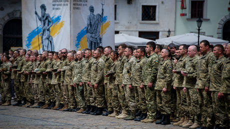 FILE PHOTO. Ukrainian troops line up during a funeral service. ©Scott Peterson / Getty Images
