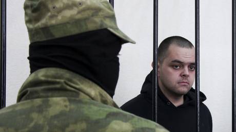 British mercenary Aiden Aslin in a courtroom in Donetsk. © AP