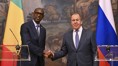 Russian Foreign Minister Sergei Lavrov, right, and his Malian counterpart Abdoulaye Diop pose during a joint press conference following their meeting in Moscow, Russia, Friday, May 20, 2022.