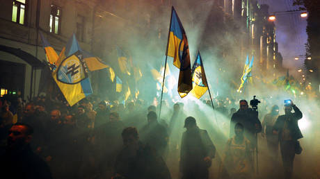 FILE PHOTO. Ukrainian nationalists and servicemen of the Azov battalion demonstrate in Kiev on October 14, 2014.