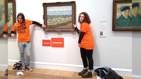 Anti-oil activists glue themselves to Van Gogh painting