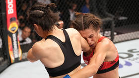 Ex-female UFC champion retires rival with spinning back fist KO (VIDEO)