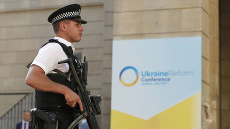 Special police forces guard the entrance ahead of a Ukraine Reform Conference at Lancaster House in London, Thursday, July 6, 2017.