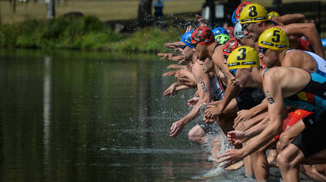 Athletes compete at the world triathlon championships. © Artur Widak / NurPhoto via Getty Images