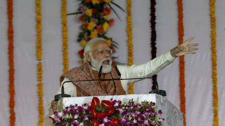 Indian Prime Minister Narendra Modi speaks as he lays the foundation stone of Major Dhyan Chand Sports University in Meerut, India, January 2, 2022.