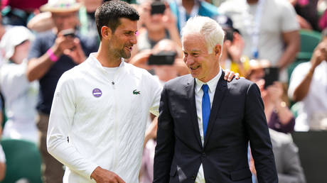 John McEnroe told the authorities to let the unvaccinated Novak Djokovic into the country. © Shi Tang / Getty Images
