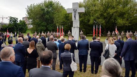 FILE PHOTO: People attend a ceremony to commemorate victims of Massacres of Poles in Volhynia and Eastern Galicia on Genocide Remembrance Day, in Warsaw, Poland. © Sputnik / Alexey Vitvitsky