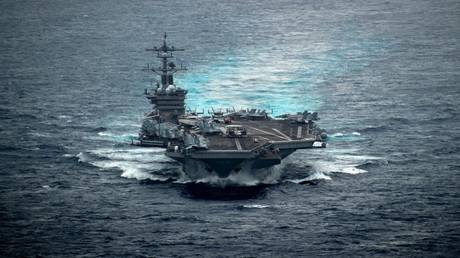 FILE PHOTO: A US Nimitz-class aircraft carrier, the USS Carl Vinson, transits the South China Sea, January 13, 2022.