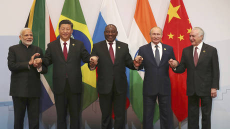 FILE PHOTO. Members of the major emerging national economies group BRICS, with from left, Indian Prime Minister Narendra Modi, China's President Xi Jinping, South African President Cyril Ramaphosa, Russia's President Vladimir Putin, and Brazil's President Michel Temer.