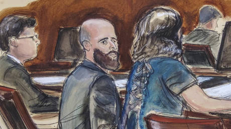 FILE PHOTO. Courtroom sketch, Joshua Schulte, center, is seated at the defense table flanked by his attorneys during jury deliberations in New York.