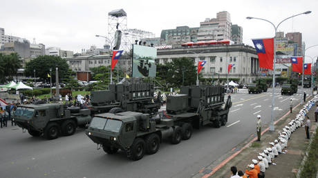 FILE PHOTO: Taiwan's US-made Patriot surface to air missile batteries pass during a parade in Taipei, Taiwan, October 10, 2007