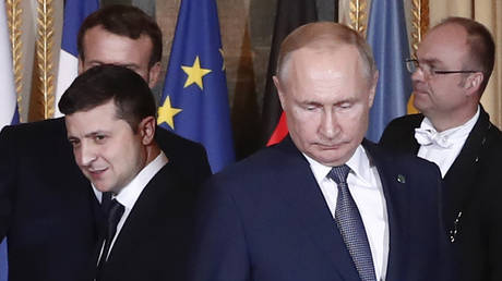 FILE PHOTO: Russian President Vladimir Putin and Ukrainian President Vladimir Zelensky arrive at the Elysee Palace, Paris, France, December 9, 2019