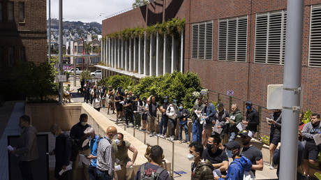 FILE PHOTO: People stand in long lines to receive the monkeypox vaccine at San Francisco General Hospital in San Francisco, July 12, 2022