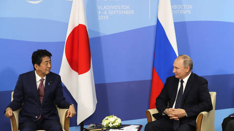 Russian President Vladimir Putin (R) and Japanese Prime Minister Shinzo Abe speak during a meeting at the Eastern Economic Forum in Vladivostok, Russia on September 5, 2019. Mikhail Metzel / TASS / AFP