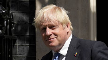 British Prime Minister Boris Johnson leaves 10 Downing Street, in London, to attend the weekly Prime Minister's Questions at the Houses of Parliament, Wednesday, July 20, 2022.