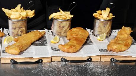 Fish and Chips are pictured before being served at lunchtime at Captain's Fish and Chip shop in Brighton. © AFP / Adrien Dennis