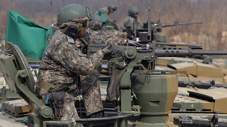 FILE PHOTO: South Korean tank crews are shown taking part in a February 2015 live-fire drill in Gyeonggi province.