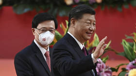 China's Xi swears in new Hong Kong leader