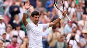 Dominant Djokovic marches on at Wimbledon