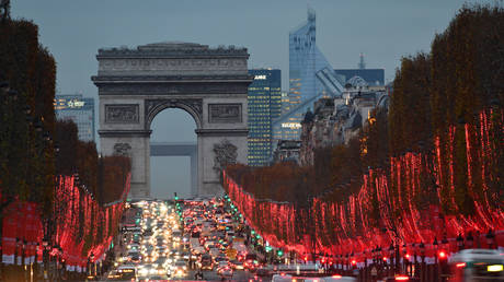 Illuminations on the Champs Elysees Avenue at night and Arc de Triomphe in Paris on December 10, 2020 in Paris, France. © Frédéric Soltan / Corbis via Getty Images