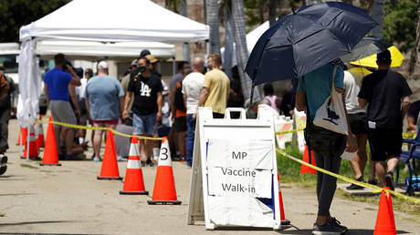 People line up at a monkeypox vaccination site on Thursday, July 28, 2022, in Encino, California.