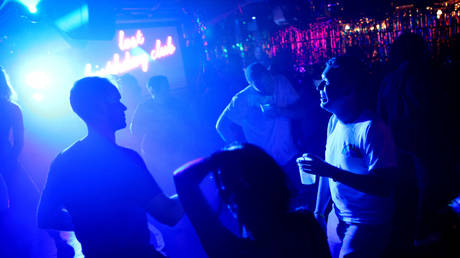 FILE PHOTO: Patrons dance at a nightclub in Washington, DC.