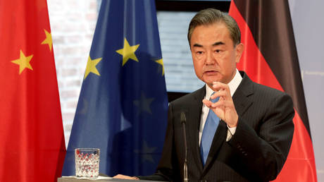Chinese Foreign Minister Wang Yi is shown speaking to reporters at a September 2020 event in Berlin.