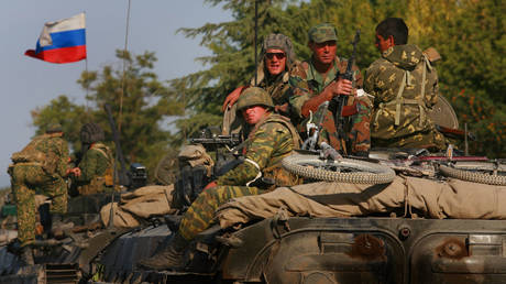 FILE PHOTO. A convoy of Russian armour heads along the main road from Gori towards Tblisi as the tense standoff on the north of Georgia continued on August 15, 2008 in Gori, Georgia.