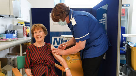 Margaret Keenan, 91, who was the first patient in the UK to receive a Covid vaccine,  gets a booster shot, April, 2022, Coventry, England.