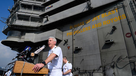 FILE PHOTO: Rear Admiral Karl O. Thomas speaks to the press on the flight deck of the USS Ronald Reagan (CVN-76) aircraft carrier. © ANTHONY WALLACE / AFP