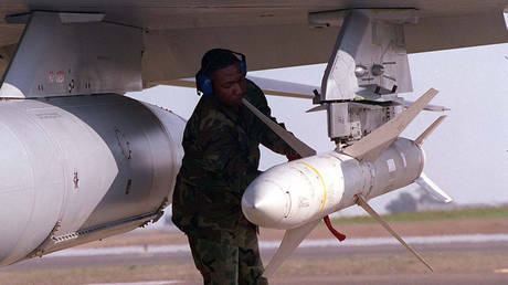 FILE PHOTO. A US weapons technician secures an AGM-88 HARM missile. ©USAF via Getty Images