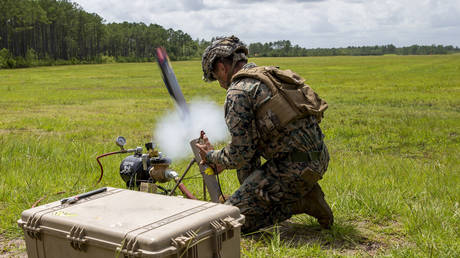 FILE PHOTO. A US Marine launches a Switchblade 300 drone. ©Marine Corps Pfc. Sarah Pysher / US Department of Defense