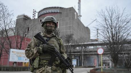 An armed Russian serviceman is seen on the territory of the Zaporozhye nuclear power plant.