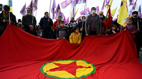 People hold the Kurdish workers party (PKK) flag during a demonstration in Marseille, southern France.