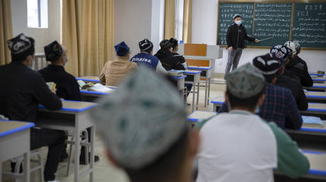 FILE PHOTO: Students training to become imams recite verses from the Quran at the Xinjiang Islamic Institute in Urumqi, the capital of China's far west Xinjiang province, April 21, 2021