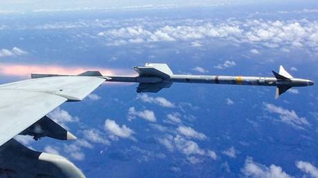 FILE PHOTO: A Sidewinder missile is fired from a US F/A-18F Super Hornet during an exercise over the Philippine Sea.