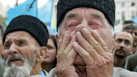 FILE PHOTO. An elderly man cries during a rally of the Crimean Tatars in downtown Simferopol, Crimea, 18 May 2004.