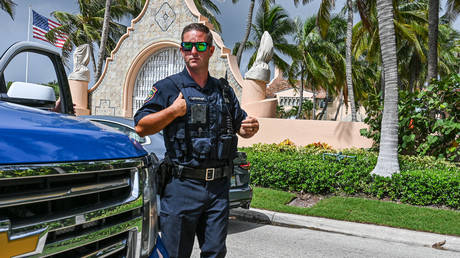 Local law enforcement officers are seen in front of the home of former President Donald Trump at Mar-A-Lago in Palm Beach, Florida on August 9, 2022.